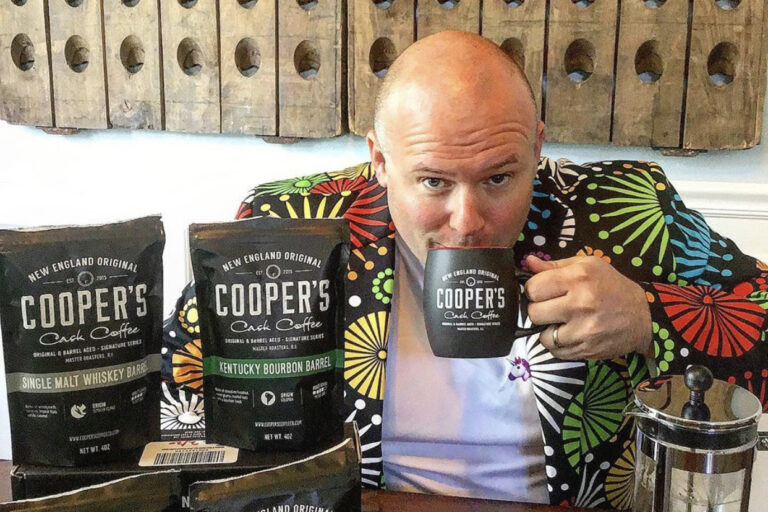 Man enjoying a cup of Cooper's Cask Coffee as one of the great whiskey gifts for dad